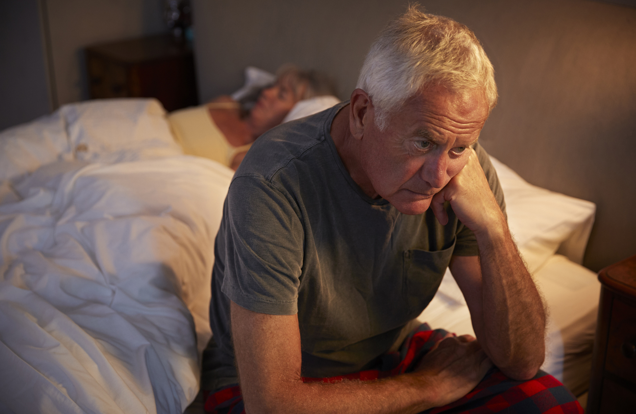 worried-senior-man-in-bed-at-night-suffering-with-insomnia